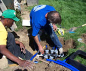 El Mirage sprinkler repair technicians unearth a valve control box